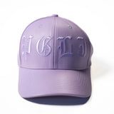 Purple cap with embroidered initials on a white background